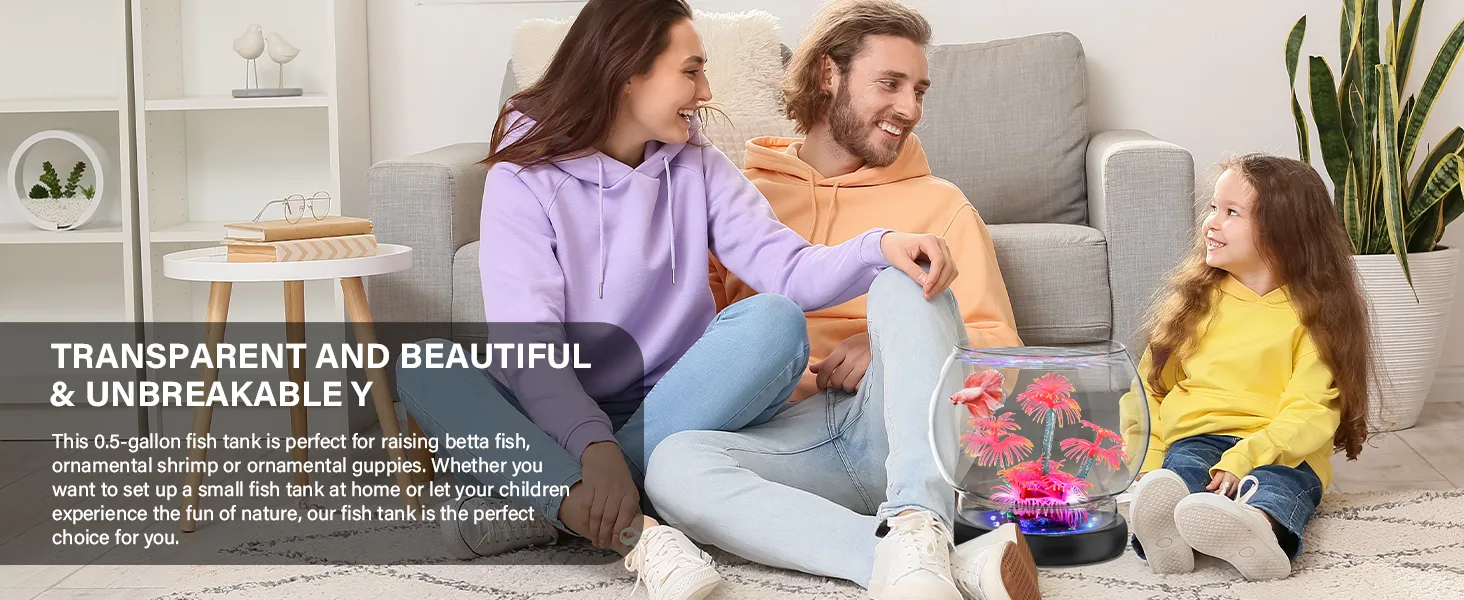 Family sitting on couch with transparent 0.5-gallon fish tank featuring betta fish and pink plants