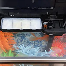 Hygger aquarium with colorful fish and decorative plants, featuring a modern filtration system and LED lighting for a vibrant