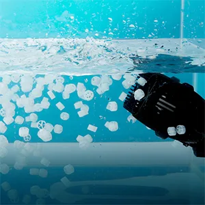 Hygger aquarium robotic cleaner removing debris from water surface with bubbles and floating particles