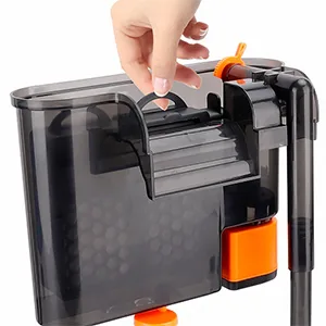 Hand opening lid of Hygger aquarium filter with orange accents and transparent tank