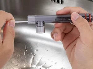 Hands adjusting a hygger aquarium water filter with a metallic faucet and water droplets on stainless steel sink