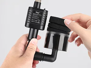 Hands assembling Hygger aquarium filter components with black plastic parts and connection ports