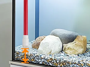 Hygger aquarium with gravel, rocks, and thermometer showing water temperature
