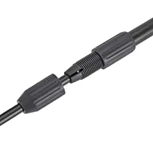 Close-up of black aquarium tubing connector with threaded metal and plastic fittings for water flow control