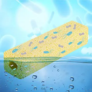 Yellow sponge with blue and purple spots floating in water with bubbles, ideal for aquarium filtration