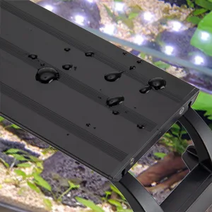 Hygger aquarium water level sensor with water droplets on black surface, showing precise monitoring for aquarium maintenance