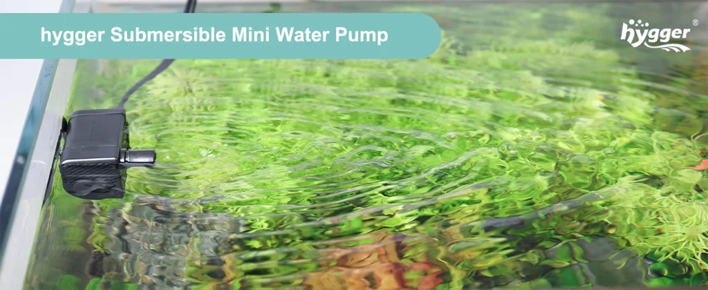 hygger Submersible Mini Water Pump creating gentle ripples in a lush green aquarium with aquatic plants