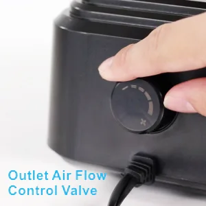 Close-up of hand adjusting outlet air flow control valve on black hygger aquarium air pump with power cord