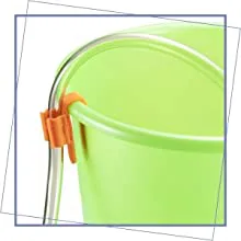 Close-up of a green hygger aquarium with an orange clip attachment on the side