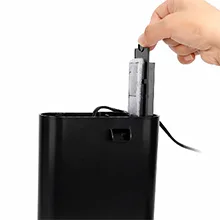 Hand inserting a USB device into a black hygger aquarium power adapter with a cable