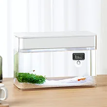 Modern hygger aquarium with digital display, green plants, and fish in a minimalist design for home decor