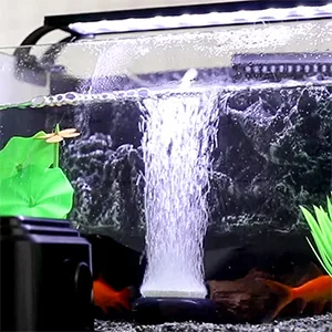 Hygger aquarium with waterfall filter, colorful fish, and green plants in a well-lit tank
