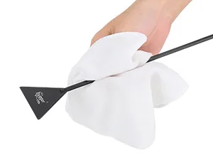 Hand holding a black aquarium brush with white cleaning cloth, cleaning aquarium equipment