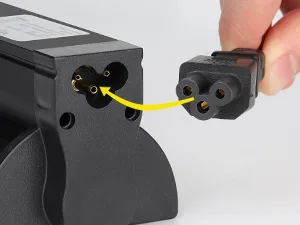 Close-up of Hygger aquarium power adapter connection with yellow wire showing plug insertion into device port