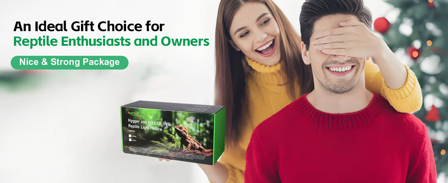 A woman presents a Hygger Zoo HO LED UVB Reptile Light Fixture box to a man, with a Christmas tree in the background. Ideal g